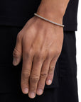 Model wearing 3mm 18k gold tennis bracelet by Iceman Society