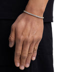 Model wearing 4mm 18k gold tennis bracelet by Iceman Society