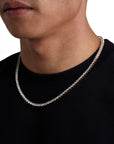 Model wearing 4mm 18k gold tennis necklace by Iceman Society, side view