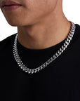 Model wearing 12mm white gold plain cuban necklace by Iceman Society, side view
