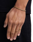 Model wearing 4mm 18k gold rope bracelet by Iceman Society