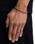 Model wearing 6mm 18k gold rope bracelet by Iceman Society