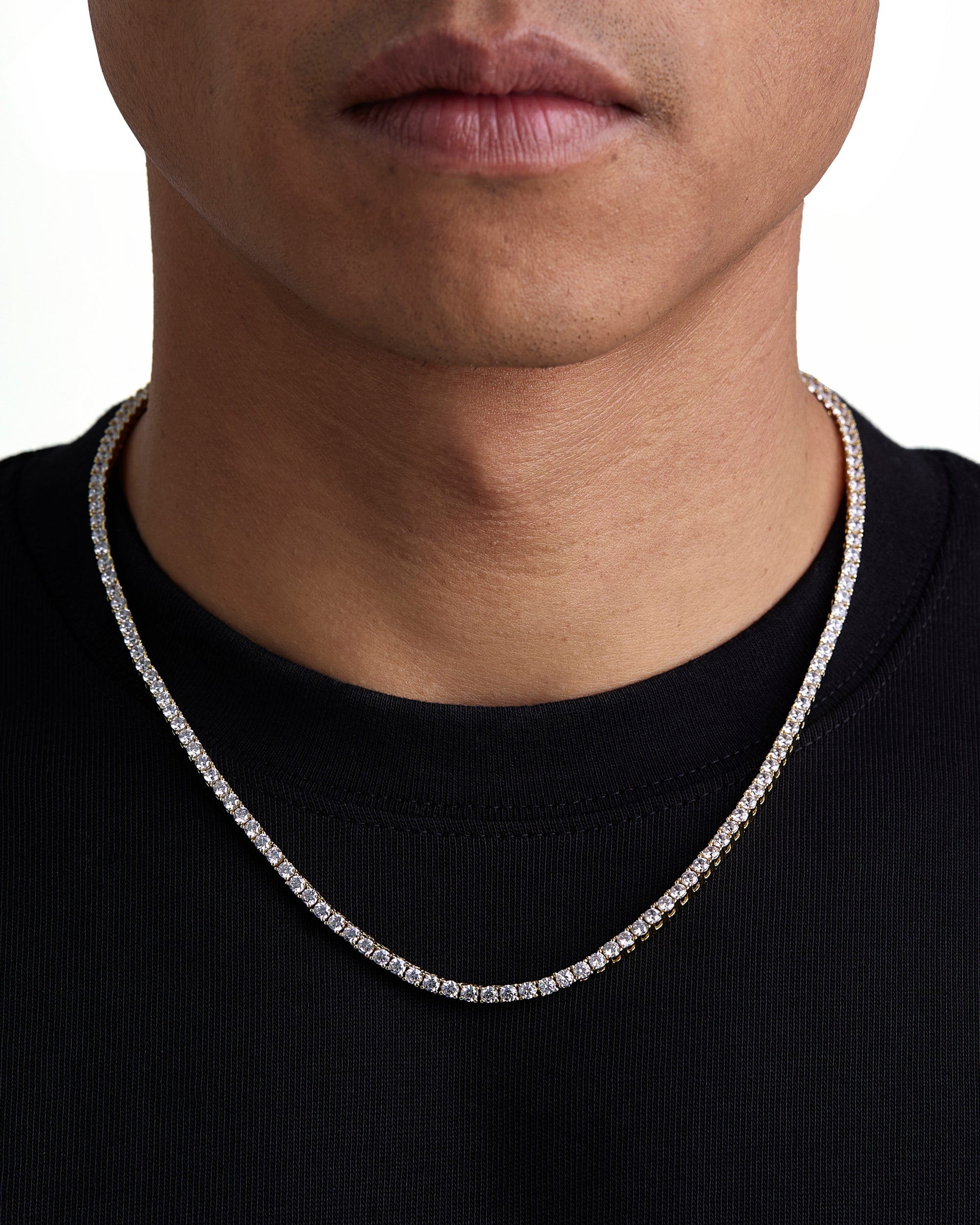 Model wearing 3mm 18k gold tennis necklace by Iceman Society, front view