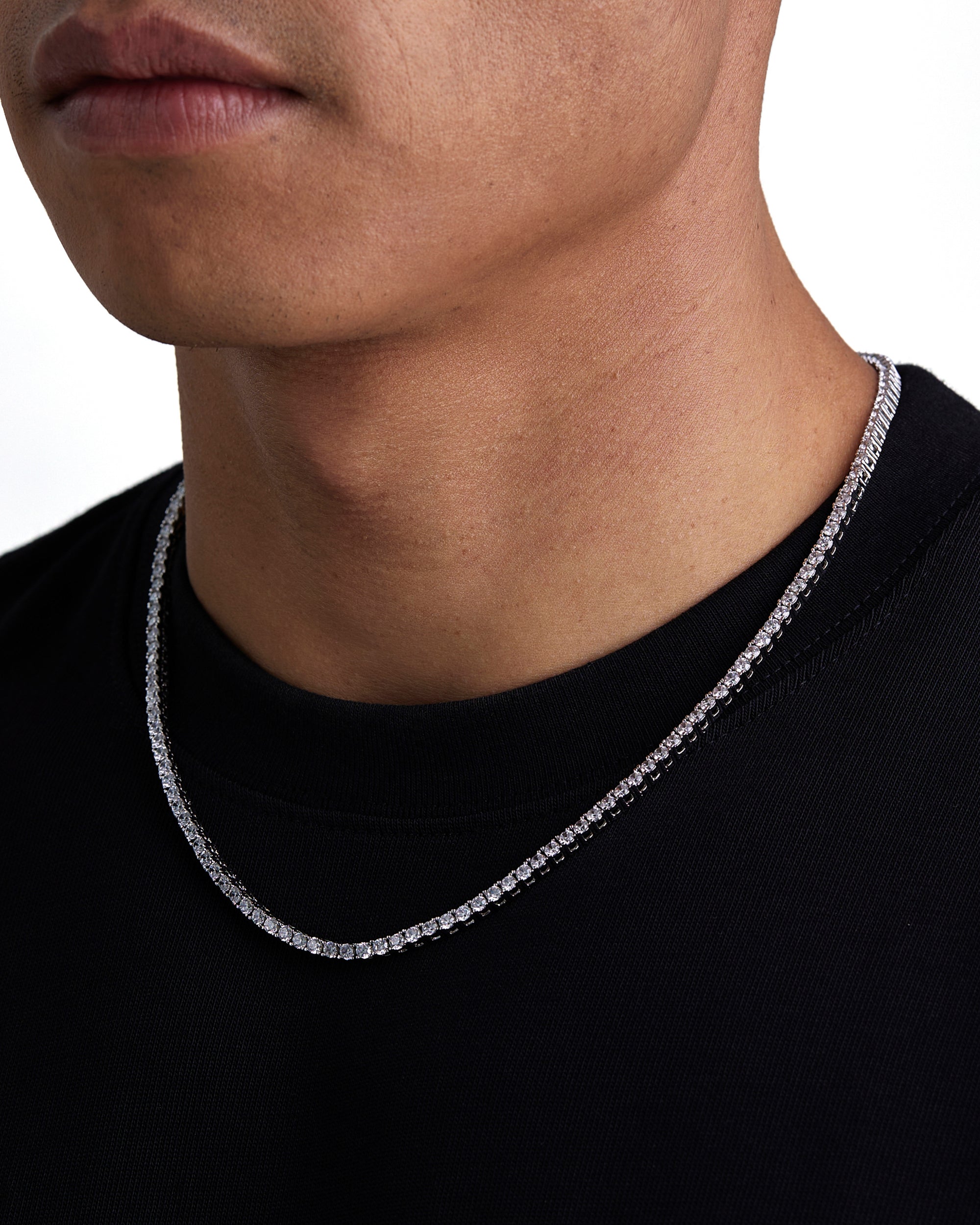 Model wearing 3mm white gold tennis necklace by Iceman Society, side view