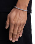 Model wearing 4mm white gold tennis bracelet by Iceman Society
