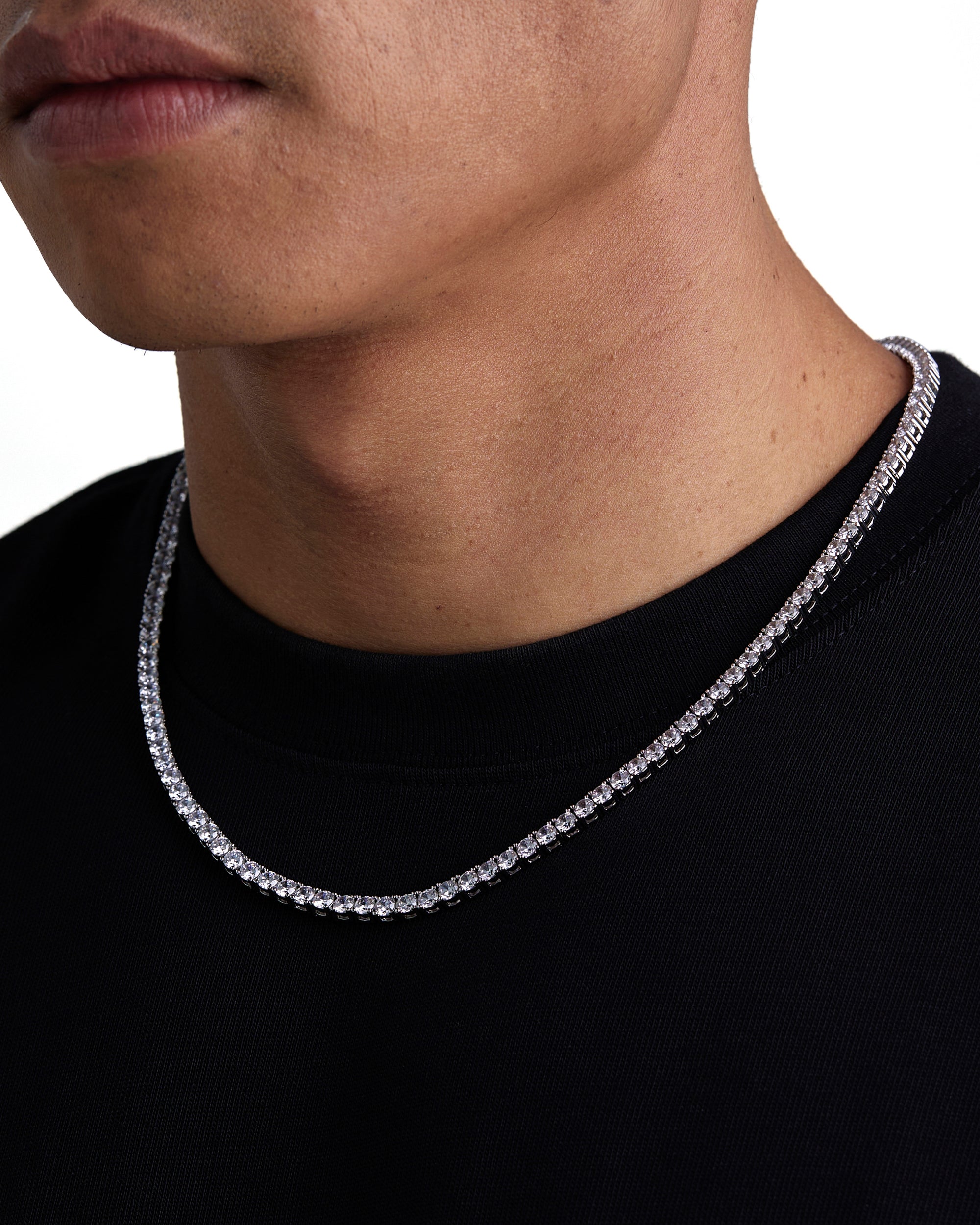 Model wearing 4mm white gold tennis necklace by Iceman Society, side view