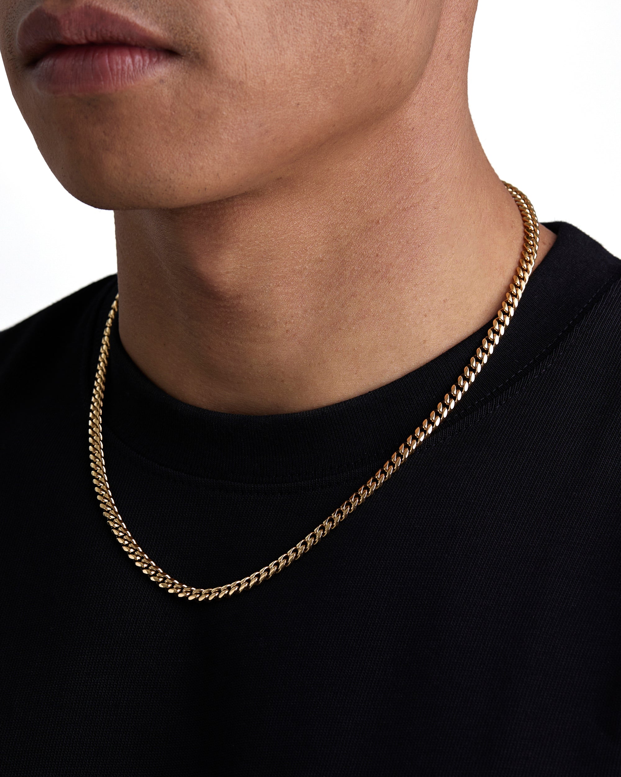 Model wearing 5mm 18k gold plain cuban necklace by Iceman Society, side view