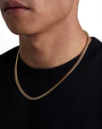 Model wearing 5mm 18k gold plain cuban necklace by Iceman Society, side view