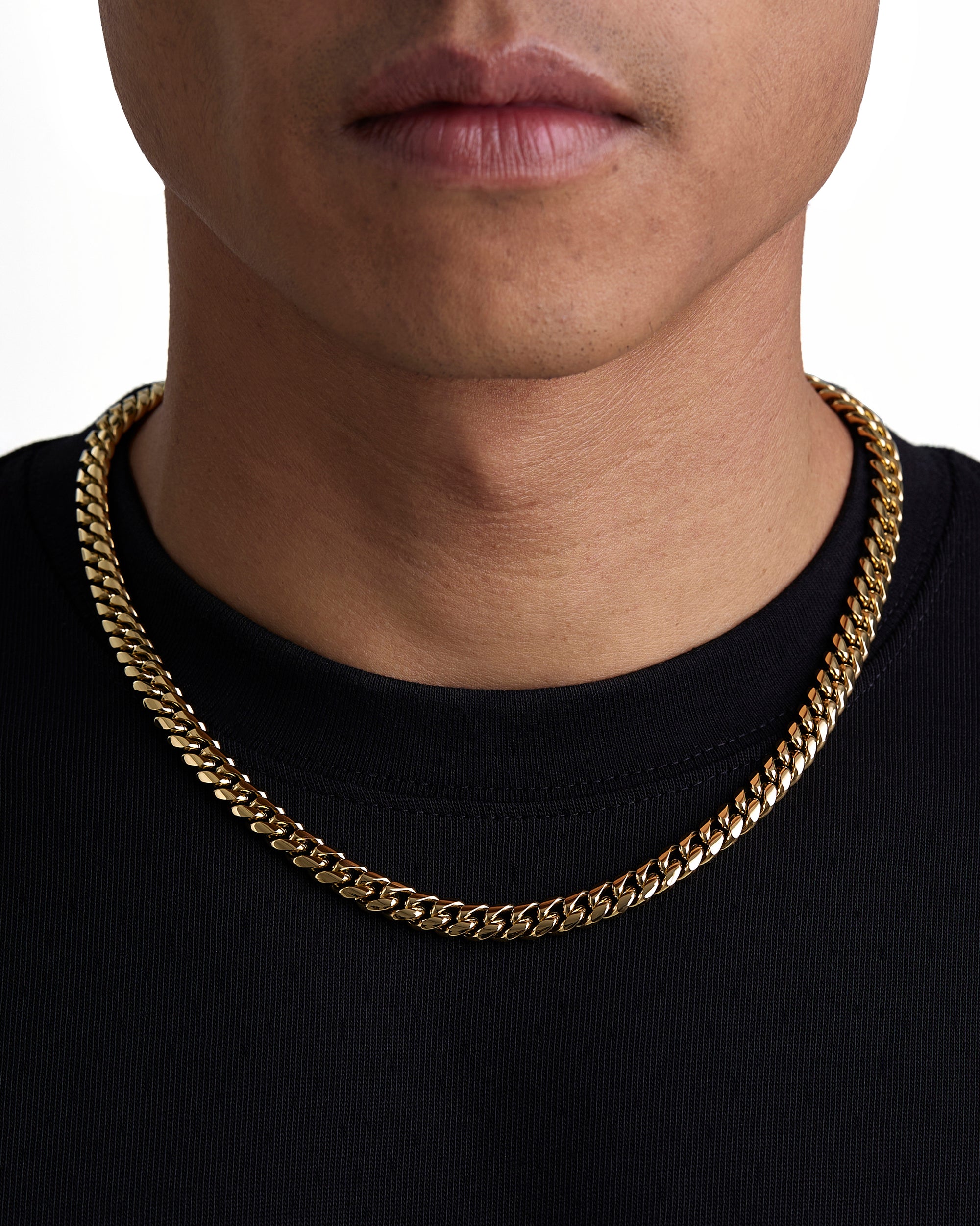 Model wearing 8mm 18k gold plain cuban necklace by Iceman Society