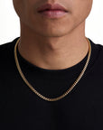 Model wearing 5mm 18K gold plain cuban chain set by Iceman Society, front view