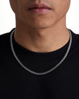 Model wearing 5mm white gold plain cuban chain set by Iceman Society, front view